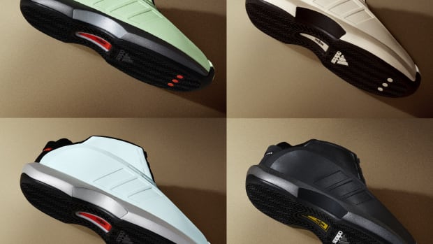 Side view of four multi-color adidas basketball sneakers.